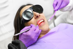 A person receiving advanced laser treatment therapies for gum disease